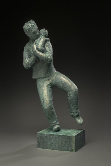 sculpture of father and infant dancing